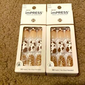 Impress cow print nails.
